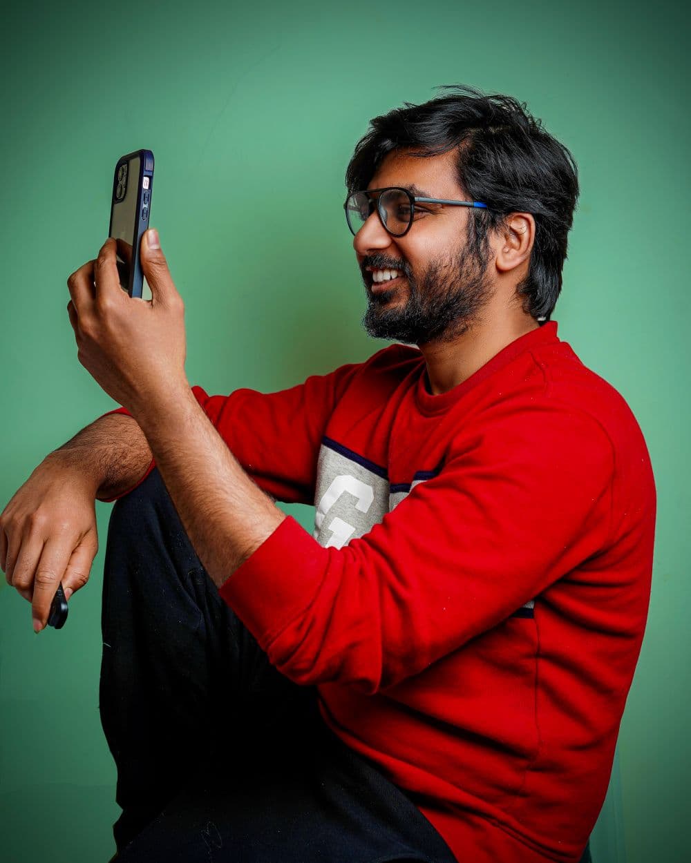 A contributor recording a message on their phone
